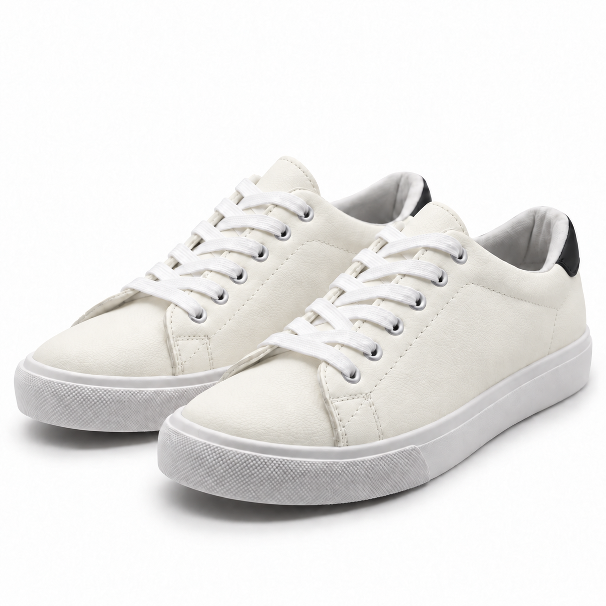 Pair, three-quarter view of warm off-white low-top sneaker with black heel patch.