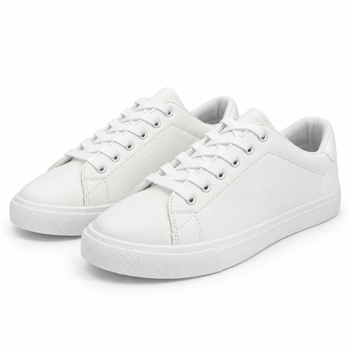 Pair, three-quarter view of textured all-white low-top sneaker.