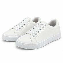 Pair, three-quarter view of fine-grain white low-top sneaker.