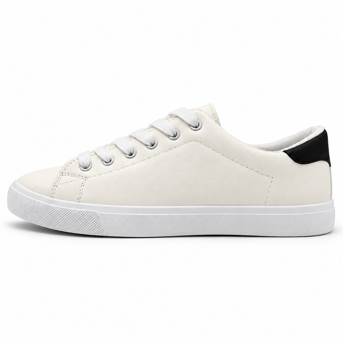 Side profile of warm off-white low-top sneaker with black heel patch.