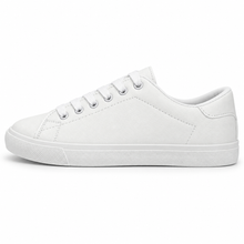 Side profile of textured all-white low-top sneaker.