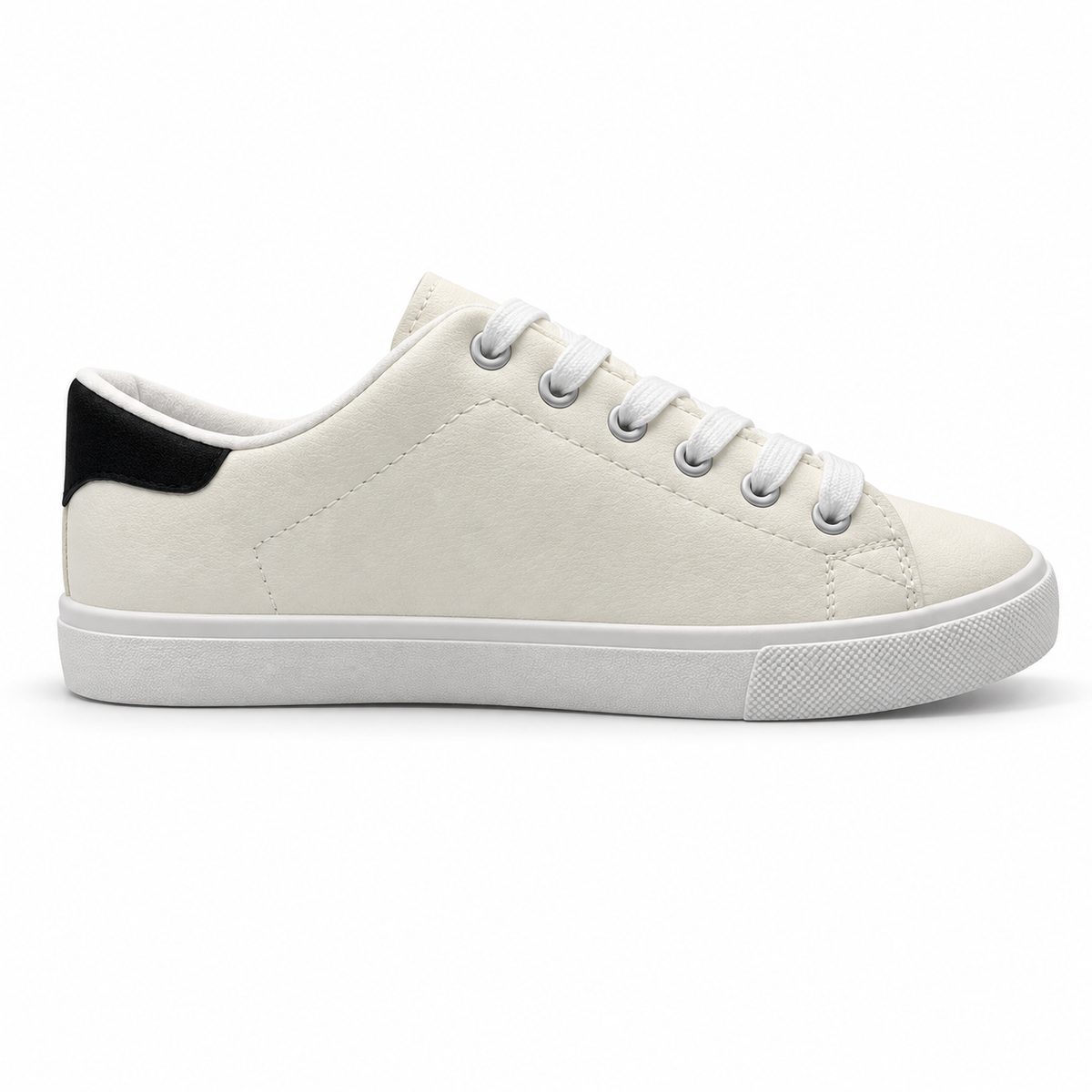 Opposite side profile of warm off-white low-top sneaker with black heel patch.