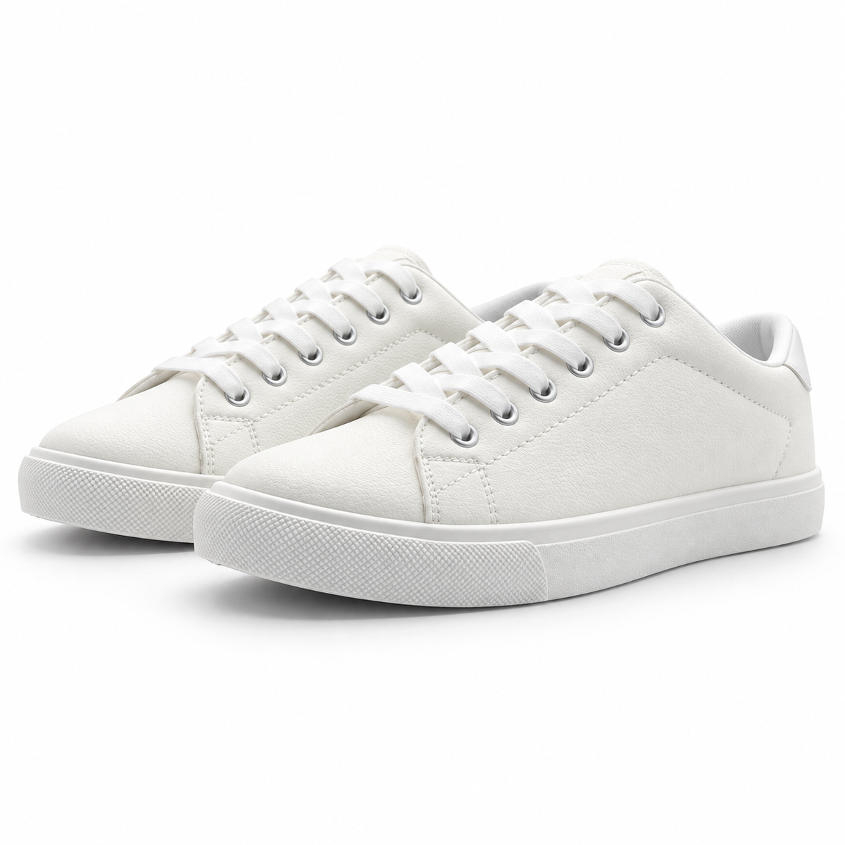 Pair, low front angle of textured all-white low-top sneaker.